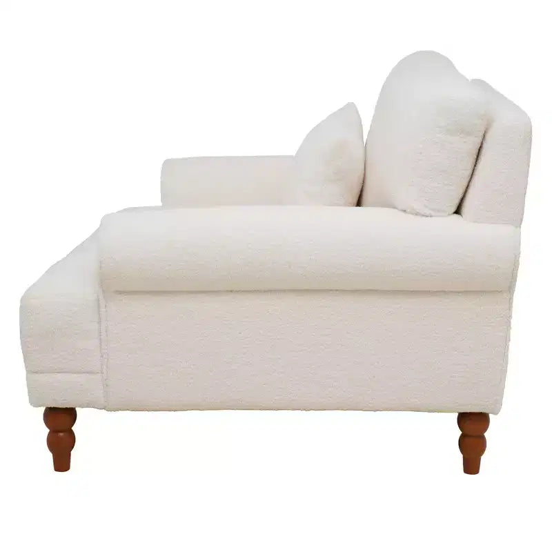 Poltrona oversize con braccioli circolari e cuscino lombare